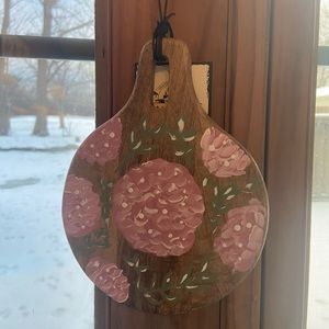 Pink flowers painted on wood sign